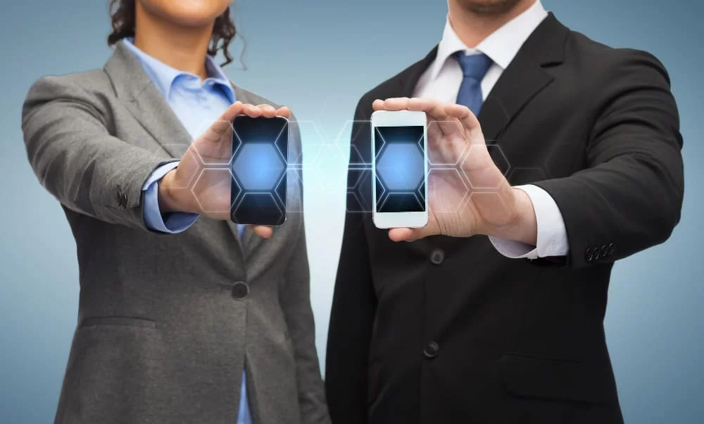 business technology internetconcept businessman businesswoman with blank black smartphone screens 1 1