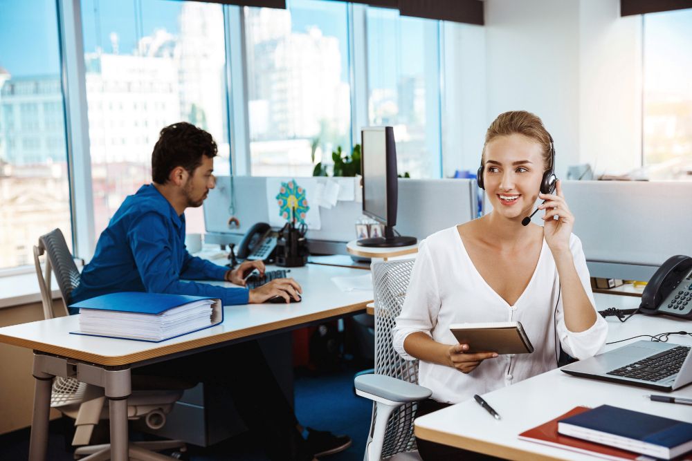 sales agent on a call in a Dubai insurance office
