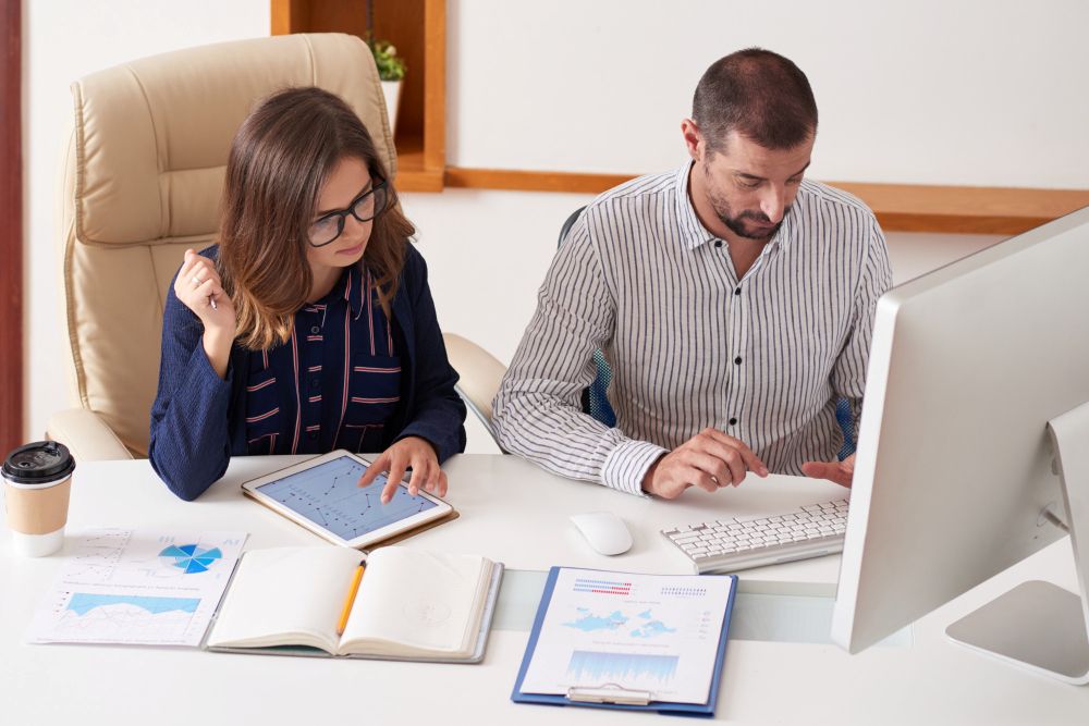 seasonal staff reviewing client documents during tax season